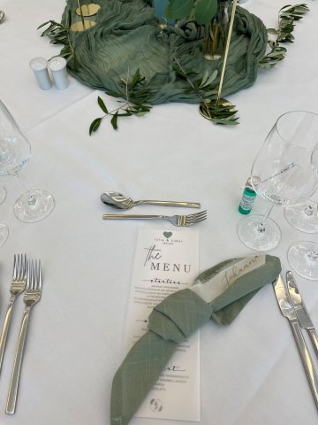 Festively set wedding table in the historic ballroom