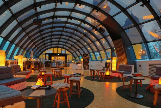 Light, design, and comfort come together in this stylish meeting space for your guests.