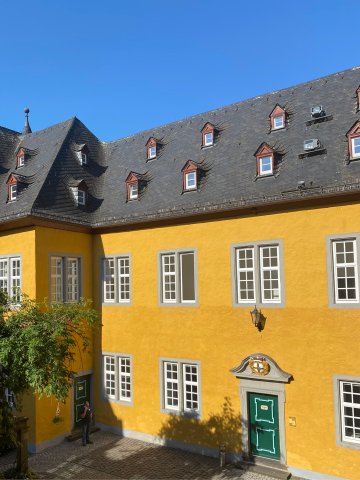 Exterior view of Hotel Schloss Montabaur with castle grounds, green parkland and historical flair