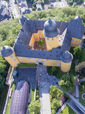 Exterior view of Hotel Schloss Montabaur with castle grounds, green parkland and historical flair