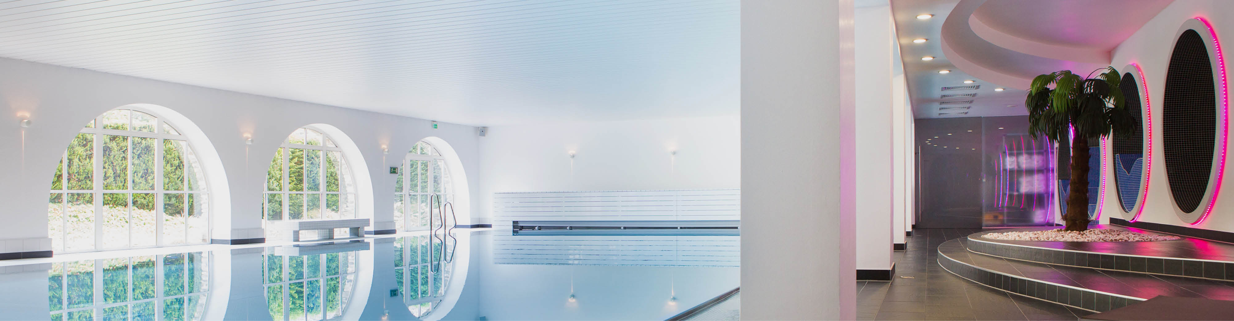 Spa Pool Area – Montabaur Castle Hotel Modern spa pool area at Montabaur Castle Hotel featuring clear water, large arched windows, and an elegant relaxation zone.